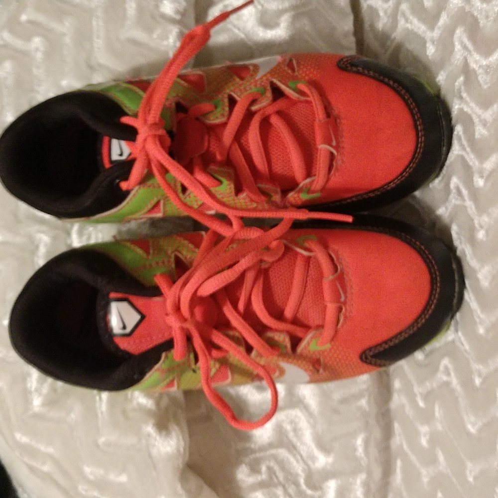 Girls Nike cleats, lime green and orange